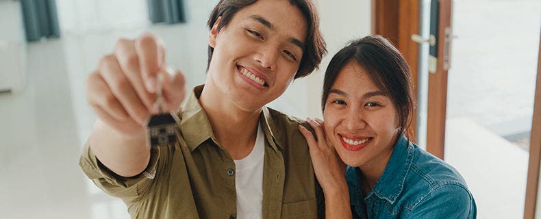 A couple celebrating for buying a house