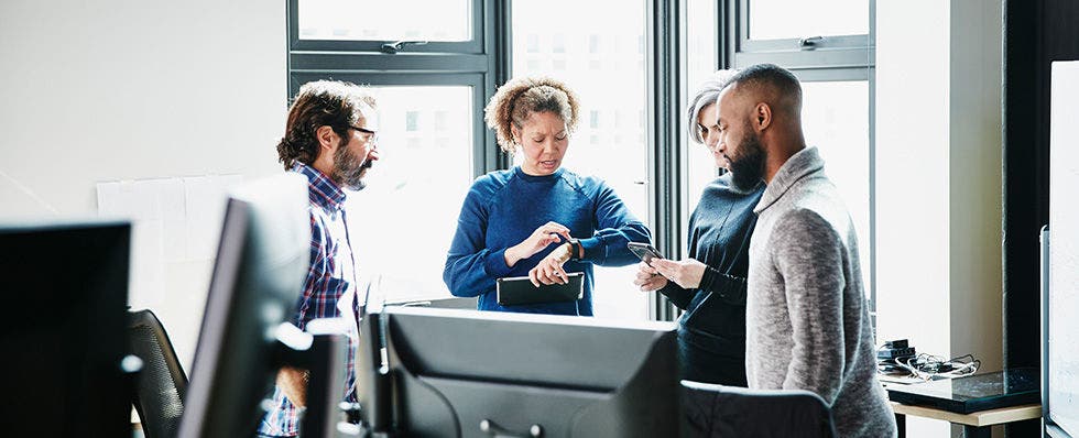 Colleagues meet to discuss their data breach plans