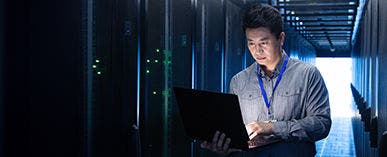 man looking at laptop 