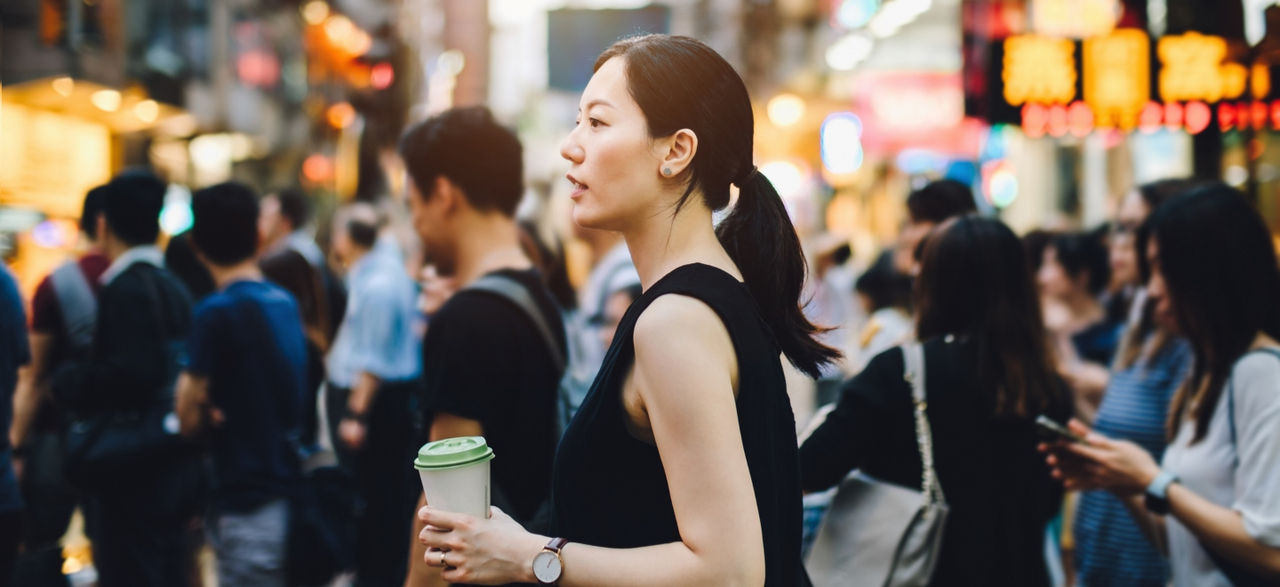 woman walking in a busy street
